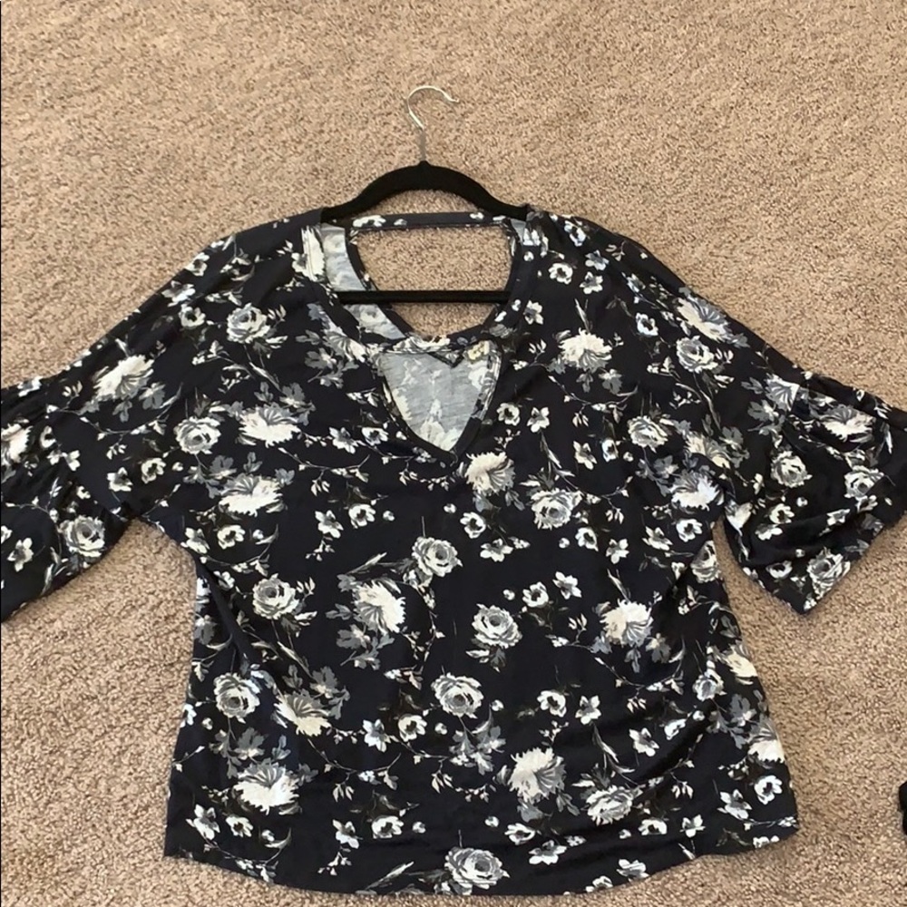 Black top w/ white floral design and neck cut out